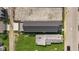 Aerial view of a property with a dark roof and a lush green yard, showcasing its layout at 1405 Deloss St, Indianapolis, IN 46201
