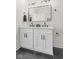 Elegant bathroom featuring double sinks, a large mirror, and modern fixtures at 1405 Deloss St, Indianapolis, IN 46201