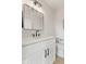 Modern bathroom featuring a vanity with white cabinets, a framed mirror and a contemporary toilet at 1405 Deloss St, Indianapolis, IN 46201