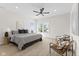 Spacious main bedroom featuring a ceiling fan, recessed lights, and multiple windows for natural light at 1405 Deloss St, Indianapolis, IN 46201