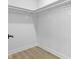 Large walk-in closet with shelving and light wood flooring at 1405 Deloss St, Indianapolis, IN 46201