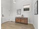 Inviting entryway with light wood floors, a stylish console table, and modern wall art at 1405 Deloss St, Indianapolis, IN 46201