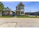 Charming two-story home with a bright yellow front door and a well-maintained lawn at 1405 Deloss St, Indianapolis, IN 46201