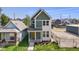 Charming two-story home with a welcoming front porch and fresh landscaping at 1405 Deloss St, Indianapolis, IN 46201