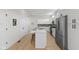 Bright kitchen with white cabinets, a large island, and stainless steel appliances for a modern and functional cooking space at 1405 Deloss St, Indianapolis, IN 46201