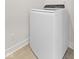 Modern white washer is located inside the laundry room at 1405 Deloss St, Indianapolis, IN 46201