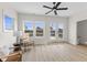 Modern living room with a view of the deck, featuring light wood floors and two comfortable chairs at 1405 Deloss St, Indianapolis, IN 46201