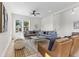 Cozy living room with stylish blue sofas, modern decor, and sunlit windows offering a welcoming and comfortable atmosphere at 1405 Deloss St, Indianapolis, IN 46201
