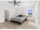 Serene bedroom with bed, stylish lamps, light wood floors, and natural light at 1405 Deloss St, Indianapolis, IN 46201