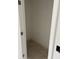 A small and empty closet with white walls and a wooden floor at 1441 Elm St, Martinsville, IN 46151