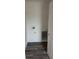 Laundry room with gray wood-look floors and white walls with hookups at 1441 Elm St, Martinsville, IN 46151