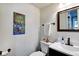 Well-lit bathroom with modern fixtures, including a sleek vanity and decorative wall art at 1548 N Park Ave, Indianapolis, IN 46202