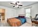 Cozy bedroom with desk, and a large window providing natural light at 1548 N Park Ave, Indianapolis, IN 46202
