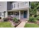 Charming home with a cozy porch, manicured landscaping, and inviting curb appeal at 1548 N Park Ave, Indianapolis, IN 46202