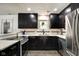Well-lit kitchen featuring stainless steel appliances, granite countertops, and modern finishes at 1548 N Park Ave, Indianapolis, IN 46202