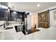 Stylish kitchen with stainless steel appliances, white countertops, and a rustic barn door at 1548 N Park Ave, Indianapolis, IN 46202