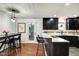 Modern kitchen with dark cabinets, marble countertops, island seating, and stylish lighting at 1548 N Park Ave, Indianapolis, IN 46202