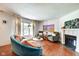 Spacious living room with large window, fireplace, hardwood flooring, and stylish decor at 1548 N Park Ave, Indianapolis, IN 46202