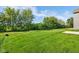 View of the backyard featuring a large green lawn and plentiful sunlight at 1669 Windrush Pl, Westfield, IN 46074