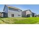 View of the backyard with the house and lush green lawn, perfect for outdoor activities at 1669 Windrush Pl, Westfield, IN 46074