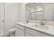 Bright bathroom featuring a double vanity with white cabinetry, a large mirror, and a toilet at 1669 Windrush Pl, Westfield, IN 46074