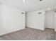 Spacious carpeted bedroom with white walls, neutral carpet, and sliding door closet at 1669 Windrush Pl, Westfield, IN 46074