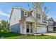 Charming two-story home with blue siding, a white brick foundation, and a well-manicured lawn at 1669 Windrush Pl, Westfield, IN 46074