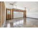 An unfinished garage features concrete floors, exposed studs, and a window at 1669 Windrush Pl, Westfield, IN 46074