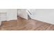 Open-concept space with light wood floors, white trim, and a staircase at 1669 Windrush Pl, Westfield, IN 46074