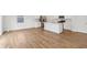 Open-concept space featuring light wood floors, a modern kitchen, and abundant natural light at 1669 Windrush Pl, Westfield, IN 46074