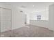 Loft featuring neutral carpet, white walls, a window, and closet at 1669 Windrush Pl, Westfield, IN 46074