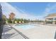 This inviting in-ground pool is surrounded by lounge chairs and lush landscaping, perfect for relaxation and enjoyment at 1669 Windrush Pl, Westfield, IN 46074