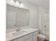 Bathroom with quartz countertop, large mirror, and tile flooring at 1694 Windrush Pl, Westfield, IN 46074