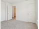 Neutral carpeted bedroom with white doors and trim at 1694 Windrush Pl, Westfield, IN 46074