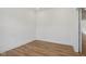 Empty room with laminate flooring, bright white walls and recessed lighting at 1694 Windrush Pl, Westfield, IN 46074