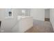 Upstairs hallway with plush neutral carpet at 1694 Windrush Pl, Westfield, IN 46074