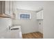 Bright laundry room with white cabinets, quartz countertop and stainless steel sink at 1694 Windrush Pl, Westfield, IN 46074