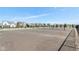 Community parking lot with ample space, surrounded by residential homes and green spaces at 1694 Windrush Pl, Westfield, IN 46074