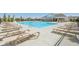 Relaxing pool area with lounge chairs and ladders for easy access at 1694 Windrush Pl, Westfield, IN 46074