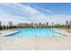 Large community pool with deck chairs is perfect for relaxation and summer fun for residents at 1694 Windrush Pl, Westfield, IN 46074