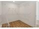 Spacious walk-in closet featuring wire shelving and wood-look flooring at 1694 Windrush Pl, Westfield, IN 46074