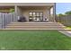 Inviting backyard featuring a spacious patio with ample seating and lush green lawn for outdoor enjoyment at 1818 N Pennsylvania St, Indianapolis, IN 46202