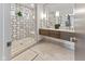 Contemporary bathroom with glass shower, marble tile, floating vanity, and dual sinks at 1818 N Pennsylvania St, Indianapolis, IN 46202