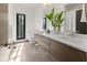Modern bathroom featuring dual sinks, a large window, and sleek fixtures at 1818 N Pennsylvania St, Indianapolis, IN 46202