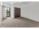 Cozy bedroom with a window offering natural light and neutral carpeting at 1818 N Pennsylvania St, Indianapolis, IN 46202