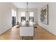 Spacious dining room featuring hardwood floors, large windows, and contemporary decor at 1818 N Pennsylvania St, Indianapolis, IN 46202