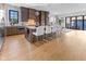 Open-concept kitchen featuring a large island with seating, stainless appliances, and hardwood floors at 1818 N Pennsylvania St, Indianapolis, IN 46202