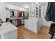 Spacious walk-in closet with custom shelving, drawers, and ample storage space at 1818 N Pennsylvania St, Indianapolis, IN 46202