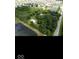 Picture of a property from above, showing a pond nearby, mature trees, and multiple buildings at 18229 Moontown Rd, Noblesville, IN 46062