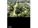 Overhead photograph of a large property near a road, featuring mature trees and outbuildings at 18229 Moontown Rd, Noblesville, IN 46062